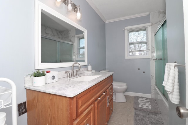 bathroom with toilet, crown molding, tile patterned flooring, baseboards, and vanity