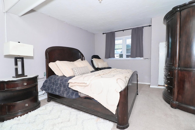 bedroom featuring baseboards and carpet floors