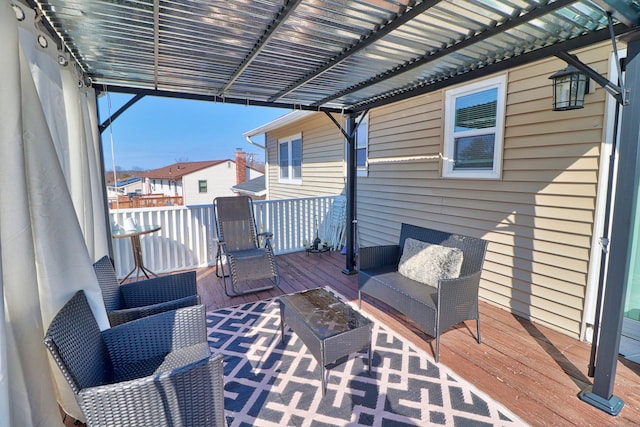 wooden terrace with a pergola and a residential view