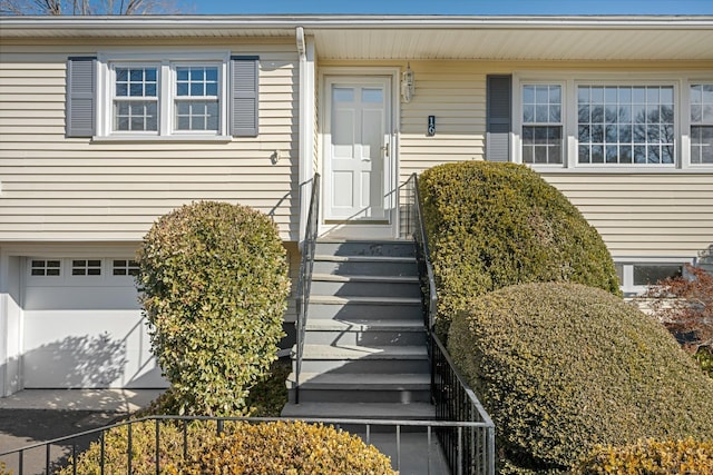 entrance to property featuring a garage