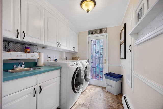 laundry area featuring cabinet space, ornamental molding, a sink, a baseboard heating unit, and independent washer and dryer