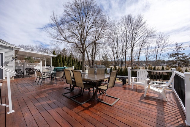 deck featuring outdoor dining area