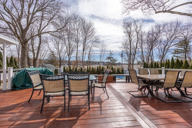 wooden deck featuring outdoor dining space