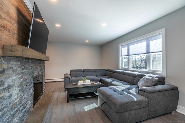 34 Indian Hill Rd, New Fairfield, CT 06812 - living room with recessed lighting, a baseboard radiator, a fireplace, and dark wood-style flooring