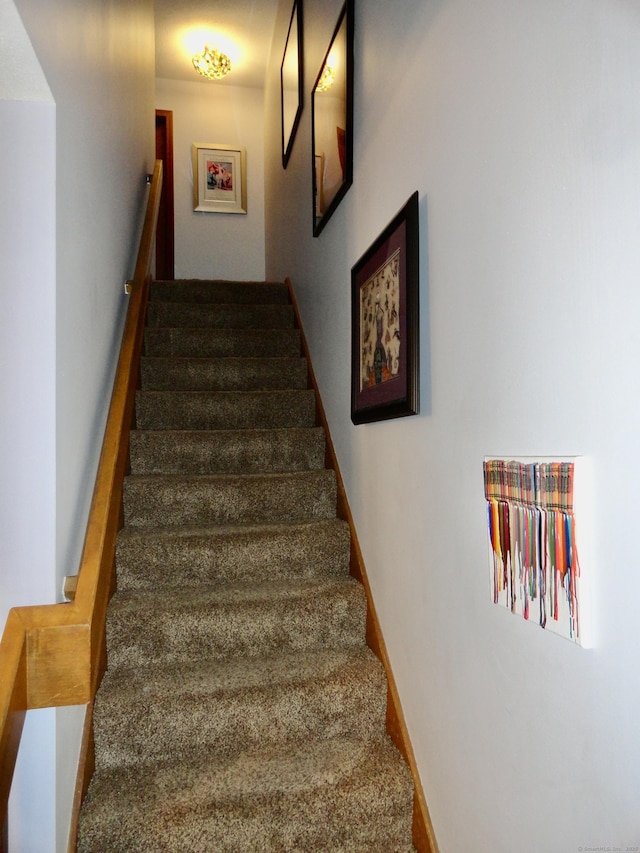 stairway featuring baseboards