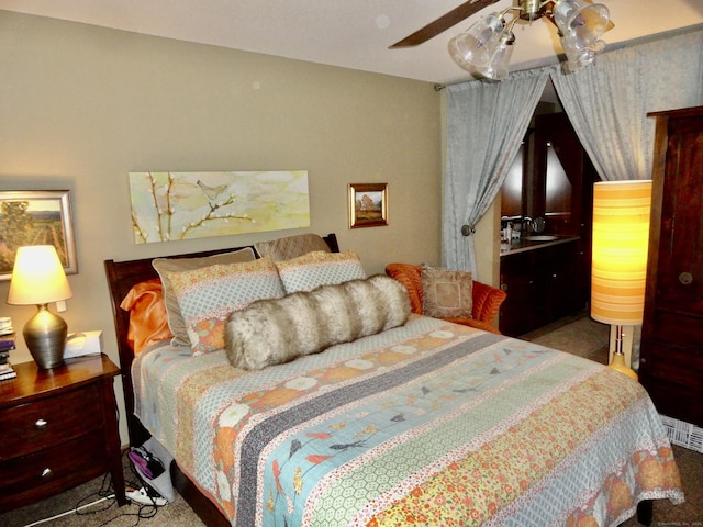 bedroom with visible vents and a ceiling fan