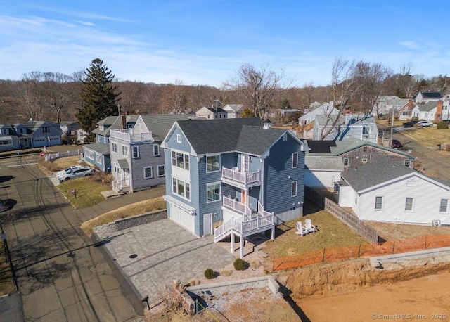 birds eye view of property with a residential view