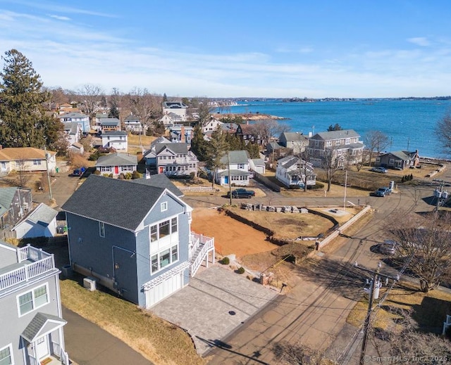 aerial view featuring a water view and a residential view