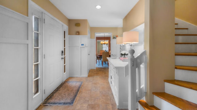 1557 Georges Hill Rd, Southbury, CT 06488 - laundry room featuring a chandelier