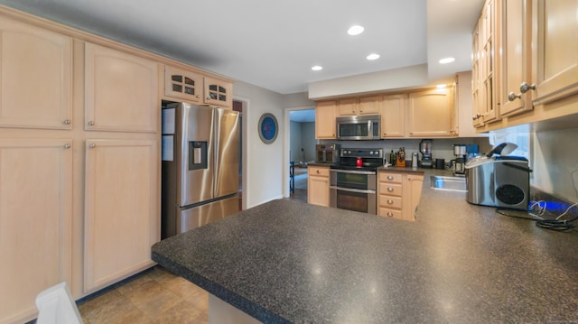 1557 Georges Hill Rd, Southbury, CT 06488 - kitchen featuring appliances with stainless steel finishes, a peninsula, dark countertops, glass insert cabinets, and recessed lighting