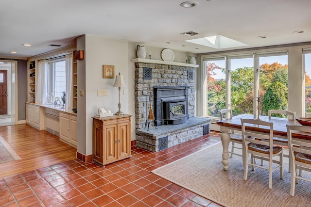 living area with recessed lighting, a skylight, visible vents, and tile patterned floors