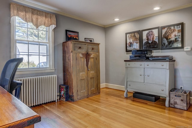 office space with recessed lighting, light wood-style flooring, radiator heating unit, ornamental molding, and baseboards