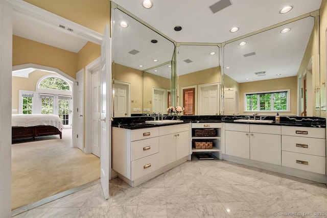 full bath with marble finish floor, visible vents, connected bathroom, and vanity