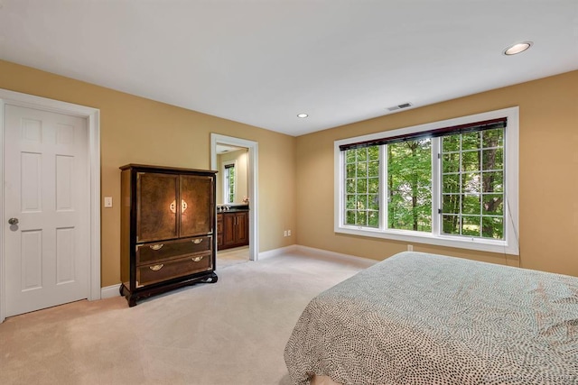 bedroom with baseboards, recessed lighting, visible vents, and light colored carpet