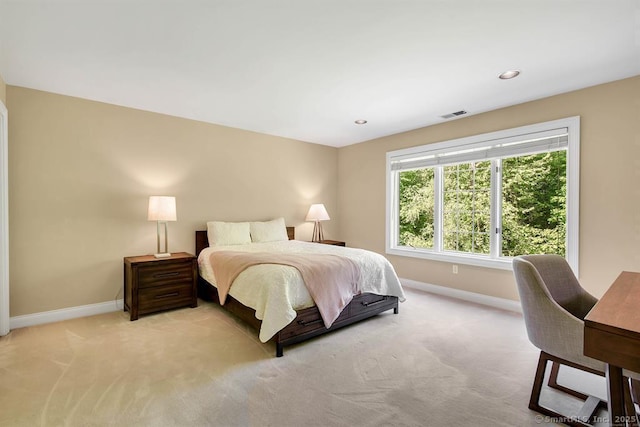 bedroom with recessed lighting, light colored carpet, visible vents, and baseboards