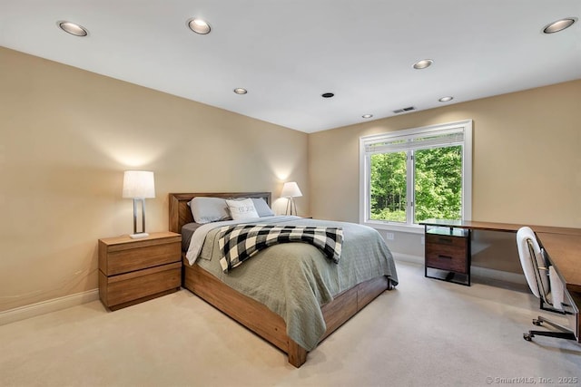 bedroom featuring light colored carpet, visible vents, and recessed lighting