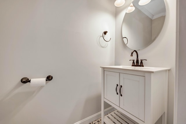 bathroom with vanity and baseboards