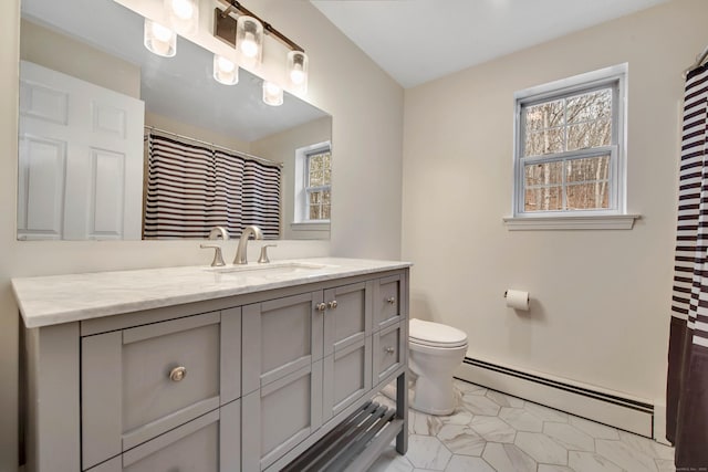 full bath with a baseboard heating unit, vanity, and toilet