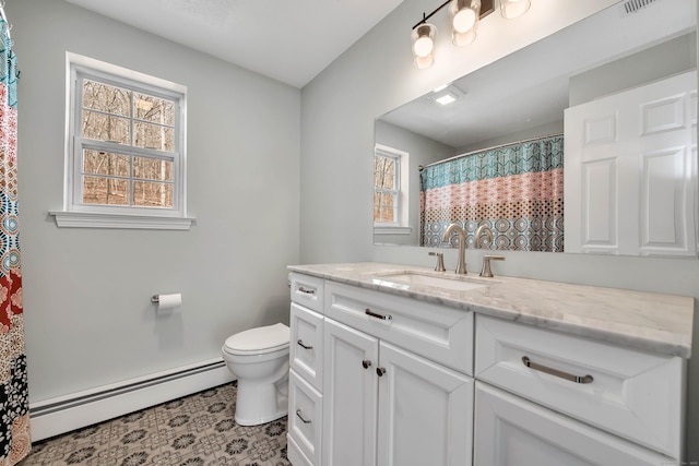 full bathroom featuring toilet, a baseboard radiator, a wealth of natural light, and vanity