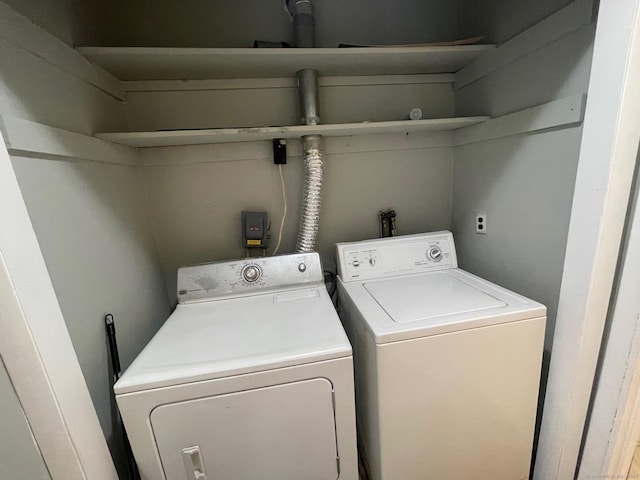 washroom with washing machine and dryer and laundry area