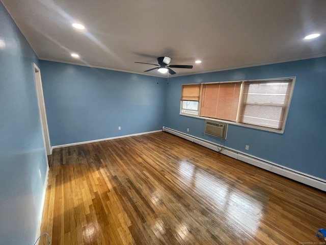 unfurnished room featuring crown molding, hardwood / wood-style floors, a ceiling fan, an AC wall unit, and baseboards