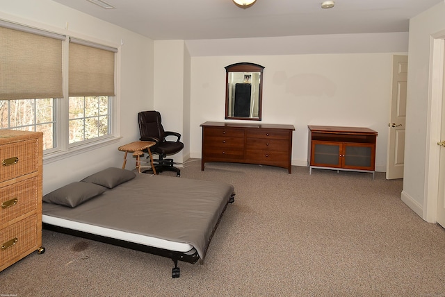 carpeted bedroom with baseboards