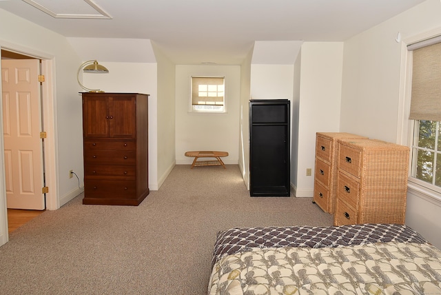 carpeted bedroom with baseboards