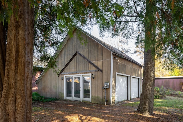 rear view of property featuring a garage