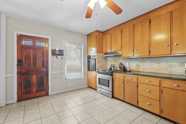 kitchen with brown cabinets, dark countertops, electric range, black oven, and under cabinet range hood