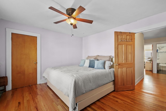 bedroom with a ceiling fan and wood finished floors