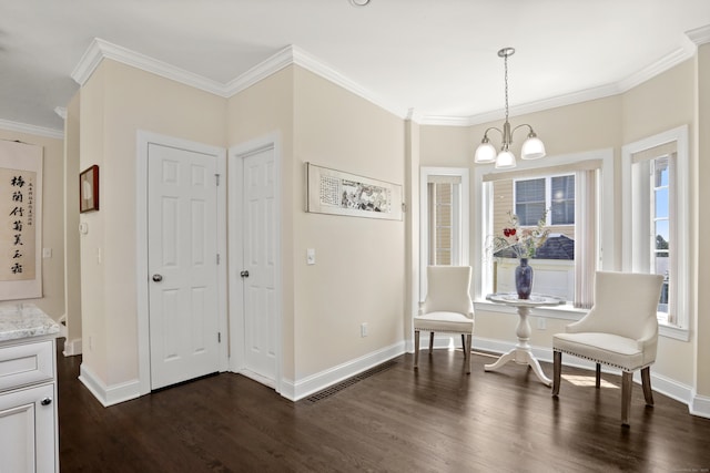 living area with a notable chandelier, visible vents, baseboards, dark wood finished floors, and crown molding