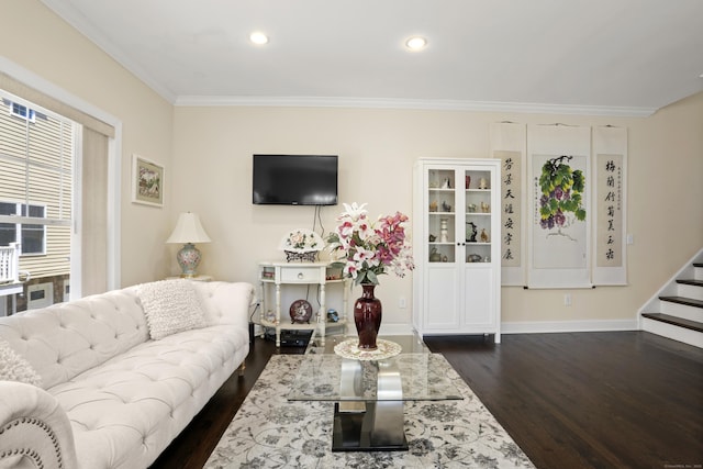 living room featuring recessed lighting, dark wood-type flooring, baseboards, ornamental molding, and stairway