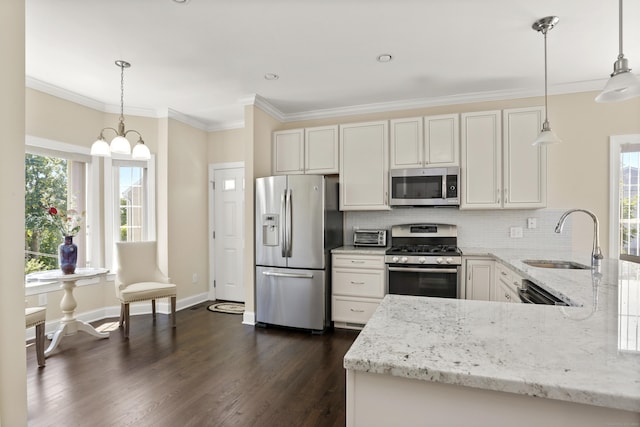 kitchen with stainless steel appliances, tasteful backsplash, a sink, and light stone countertops