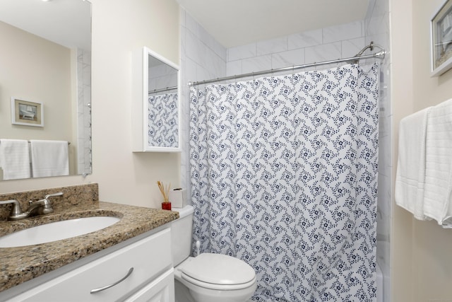 bathroom featuring vanity, toilet, and a shower with curtain