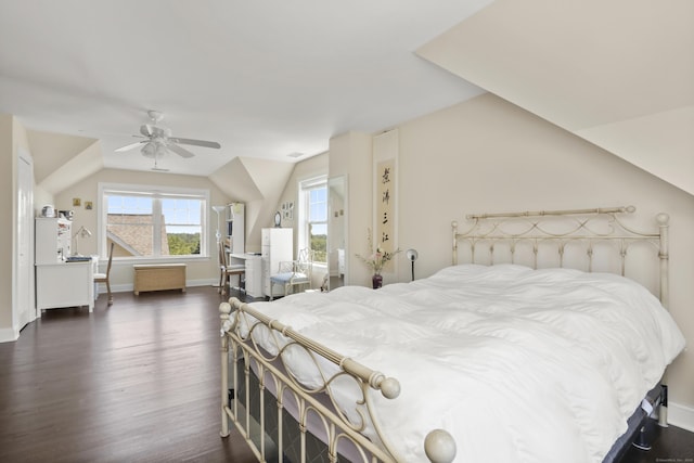 bedroom with lofted ceiling, dark wood finished floors, a ceiling fan, and baseboards