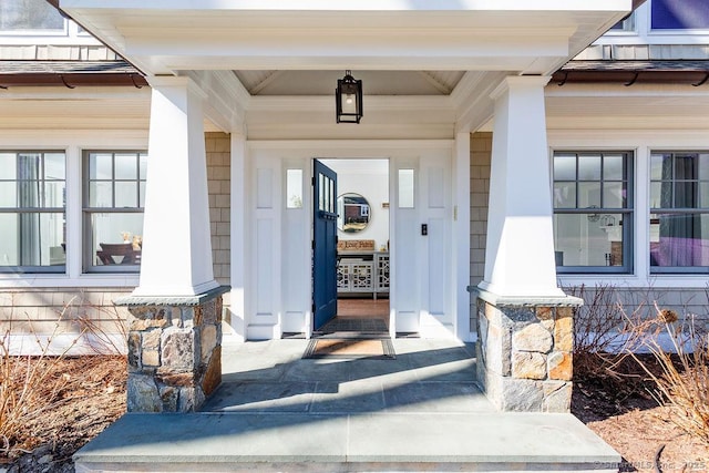 property entrance with covered porch