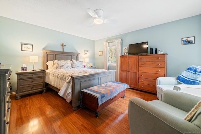 bedroom featuring a ceiling fan and wood finished floors