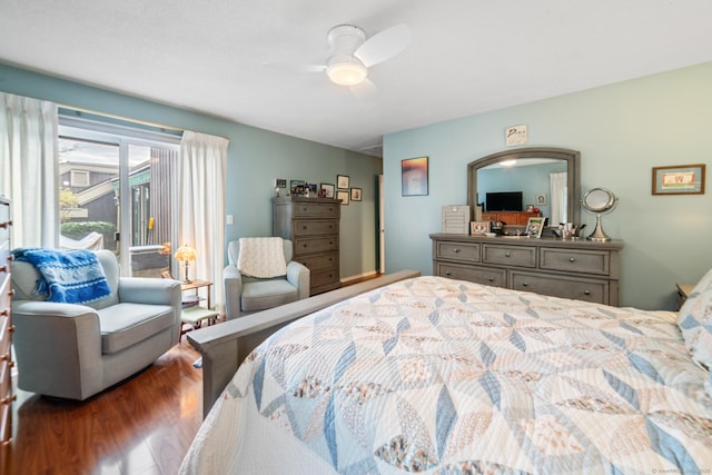 bedroom with access to exterior, ceiling fan, and dark wood-style flooring