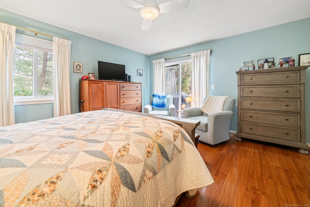 bedroom with a ceiling fan and wood finished floors