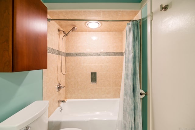 bathroom with shower / bathtub combination with curtain and toilet