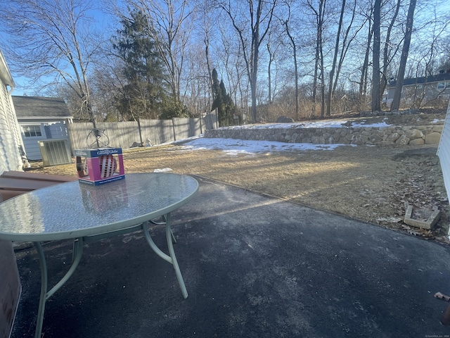 view of patio featuring fence