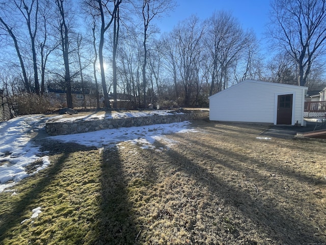 yard layered in snow with a deck