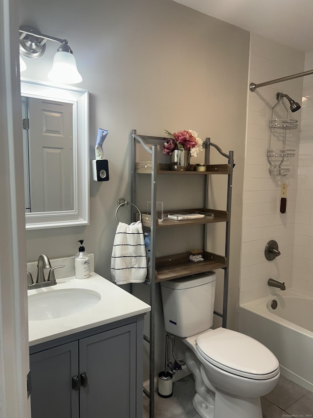 full bathroom featuring tile patterned flooring, vanity, toilet, and bathing tub / shower combination