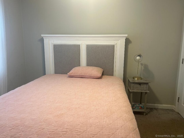 carpeted bedroom with baseboards