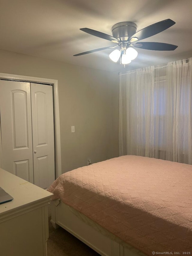 bedroom with a closet and ceiling fan