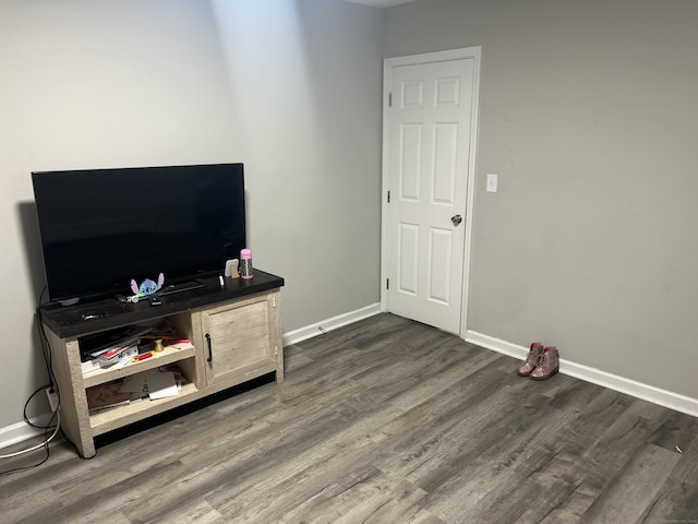 living room featuring dark wood-style floors and baseboards