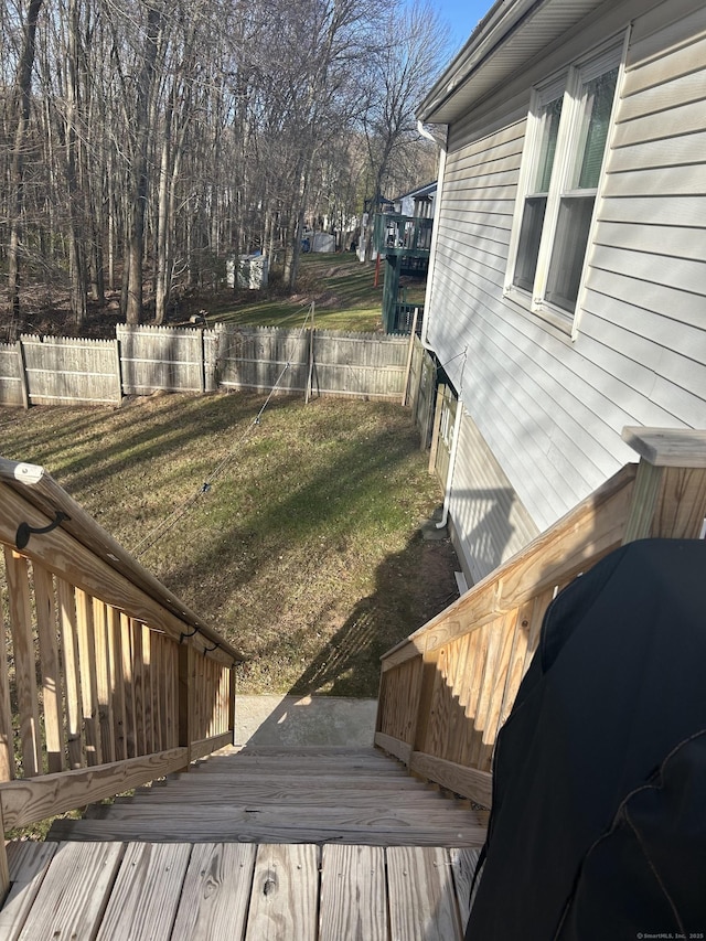 deck featuring a yard, area for grilling, and fence