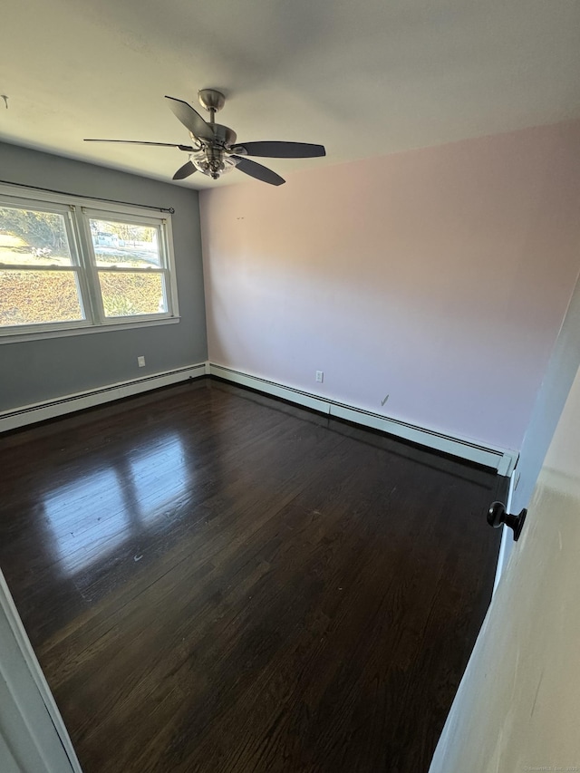 empty room with dark wood-type flooring, a baseboard radiator, a ceiling fan, and baseboards