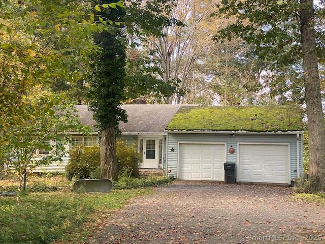 single story home featuring driveway