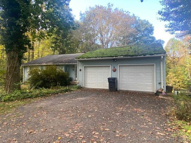 garage featuring driveway